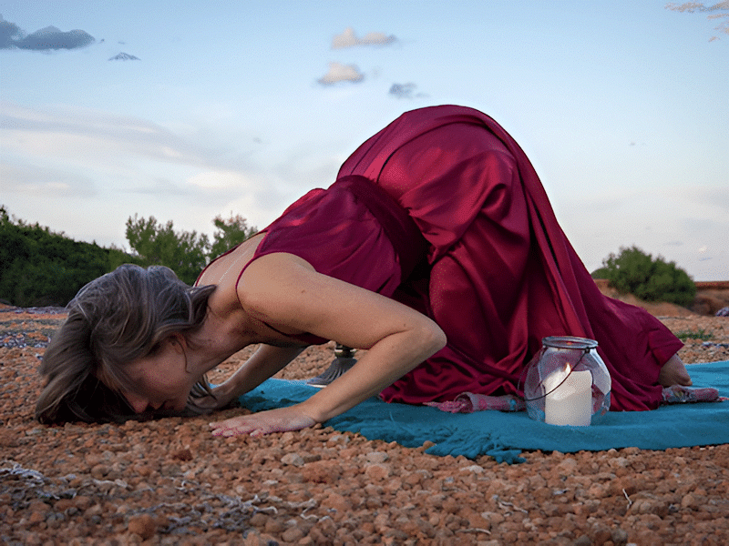 Sally Cowman conducting a ritual outdoors.